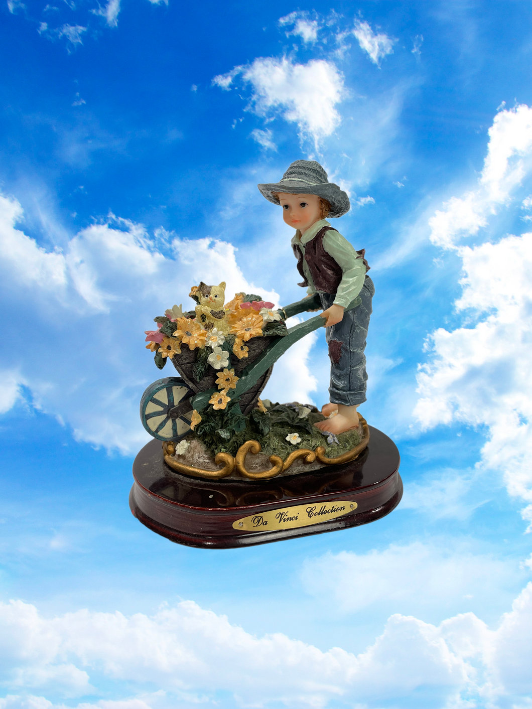 Boy with Wheelbarrow Flower Statue
